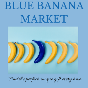 One large blue banana in the middle of a row of yellow bananas. Store name on top: "Blue Banana Market." Text below: "Find the perfect unique gift every time."