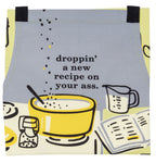 Front of apron, grey with white and yellow illustrations, reads "droppin' a new recipe on your ass."