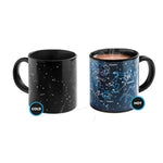 Image of Starry Night Morph Mugs in Cold and Hot states. Cold mug shows constellations as pinpoints against black, hot mug (containing steaming beverage) shows constellations as classical figures, with their names.