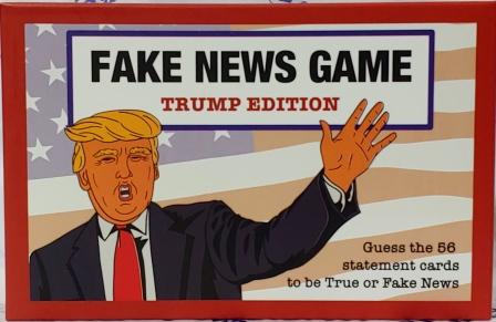 Cover of "Fake News Game Trump Edition" with cartoon image of Donald Trump in front of American flag. Text at bottom right reads "Guess the 56 statement cards to be True or Fake News."