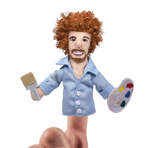 Bob Ross finger puppet holding paint brush and palette on finger.