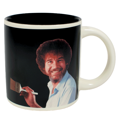 Gif of Bob Ross heat changing mug. Image of Bob Ross smiling at onlooker and holding paint brush against background that changes from black to a nature scene with cottage.