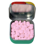 Open tin of Dilithium Crystals tin, showing round pale pink mints. 
