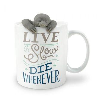 White mug with cute grey sloth infuser peeking over the edge. Text on mug reads "Live Slow" in grey and "Die Whenever" in dark blue. 